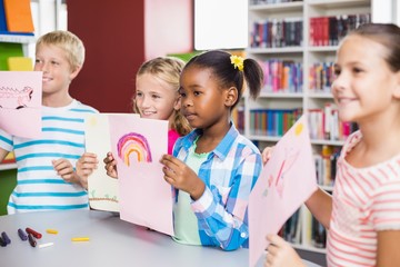 Fototapeta premium Kids showing drawing in library