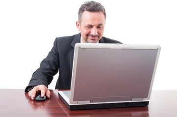 Handsome businessman working with laptop at office