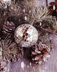 Christmas balls with fir branches and glasses of champagne