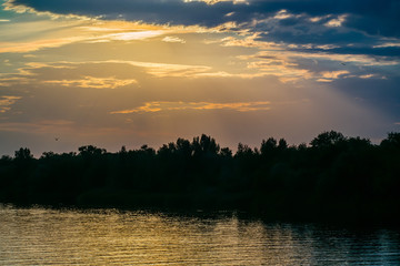 Fototapeta na wymiar River at sunset