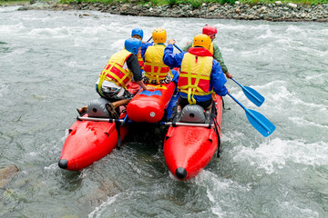 rafting on a catamaran on the mountain river