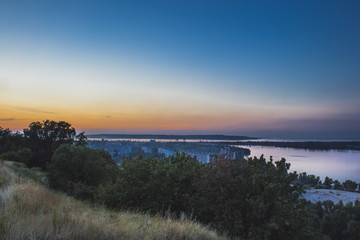 Evening Dnieper river covered with haze. Kaniv. Ukraine