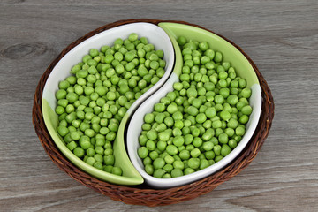 Green peas in ceramic bowls