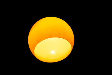 Yellow lamp light on black background