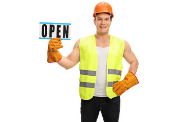Worker holding an open sign