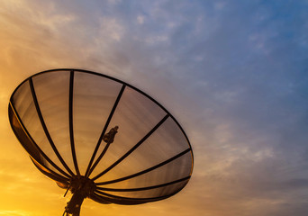 Satellite dish on sunrise background