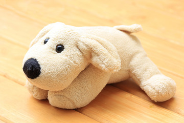  Doll Dog brown on a wooden background