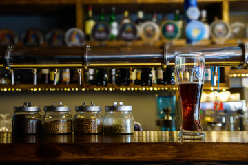 Fototapeta premium Glass of beer at pub