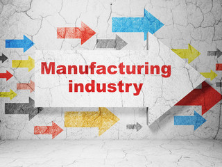 Manufacuring concept: arrow with Manufacturing Industry on grunge wall background