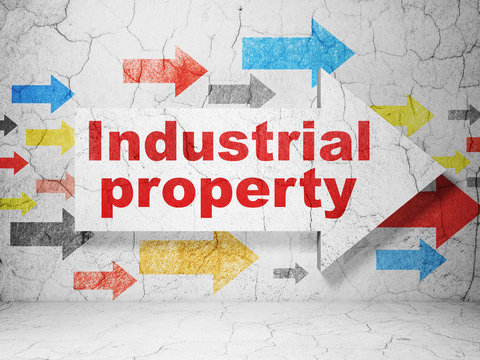 Law concept: arrow with Industrial Property on grunge wall background