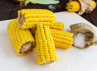 Cooked and raw corncobs. Close up