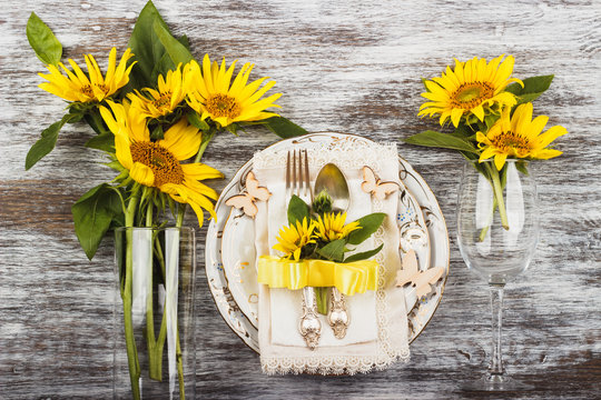 Tableware and silverware with sunflowers