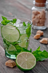 refreshing drink mojitos on wooden table decorated with brown sugar