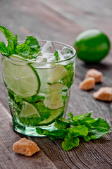 refreshing drink mojitos on wooden table decorated with brown sugar