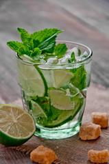 refreshing drink mojitos on wooden table decorated with brown sugar