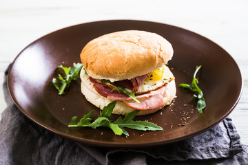 Sandwich with meat and fried egg