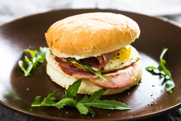 Sandwich with meat and fried egg