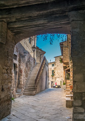 Narrow street and archway in Montemerano, Tuscany