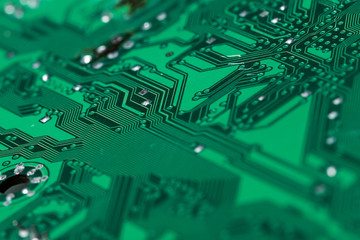 Close up of a printed green computer circuit board