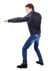Naklejka premium back view of guy funny fights waving his arms and legs. Isolated over white background. Rear view people collection. backside view of person. Curly guy in a black leather jacket fun waving his arms. 