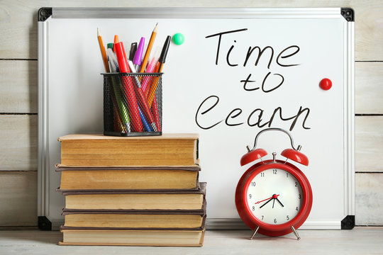 School supplies on wooden background. Time to learn