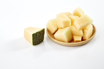 melon slice on wooden plate