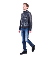 Back view of going  handsome man. walking young guy . Rear view people collection.  backside view of person.  Isolated over white background. Curly guy in a black leather jacket is proudly raising his