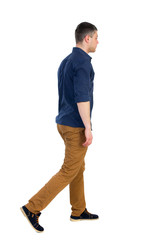 Back view of going  handsome man. walking young guy . Rear view people collection.  backside view of person.  Isolated over white background. a man in a blue shirt with the sleeves rolled up, sad is