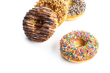 various donuts on white background