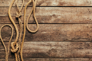 ship rope on wooden background © fotofabrika