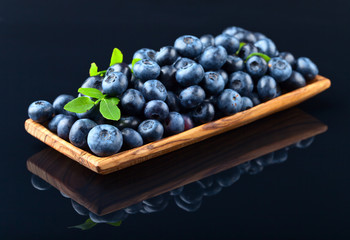 blueberries in wooden dish