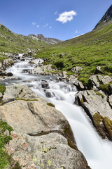 Naklejka na ściany i meble Alpine mountain stream