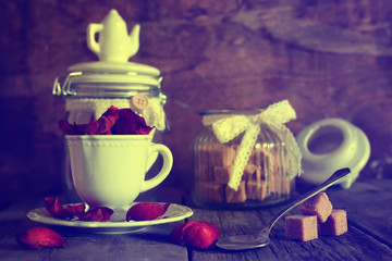 toned photo tea cup with sugar cubes