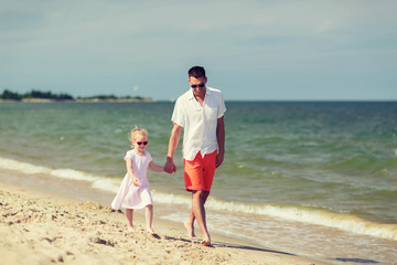 happy family in sunglasses on summer beach