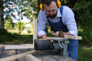 beard man working on Circular saw