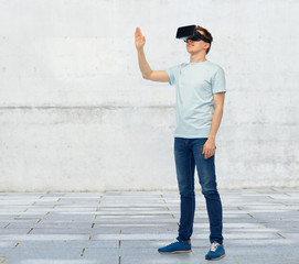 Obraz na płótnie Canvas happy man in virtual reality headset or 3d glasses