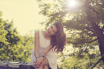 Young attractive woman posing outdoors.

