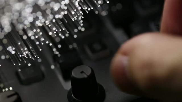 Disc jockey playing music on modern midi controller