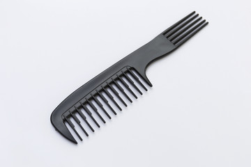 Back plastic comb design on white background