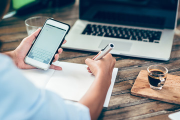 Woman taking notes on paper
