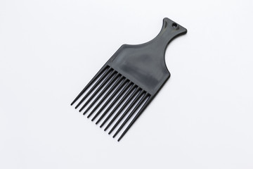 Black plastic comb isolate on white background