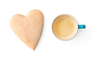 Cup of Coffee next to wooden heart