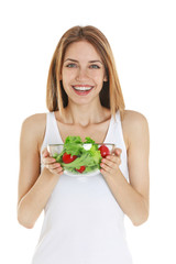 Woman holding a bowl of salad on white background