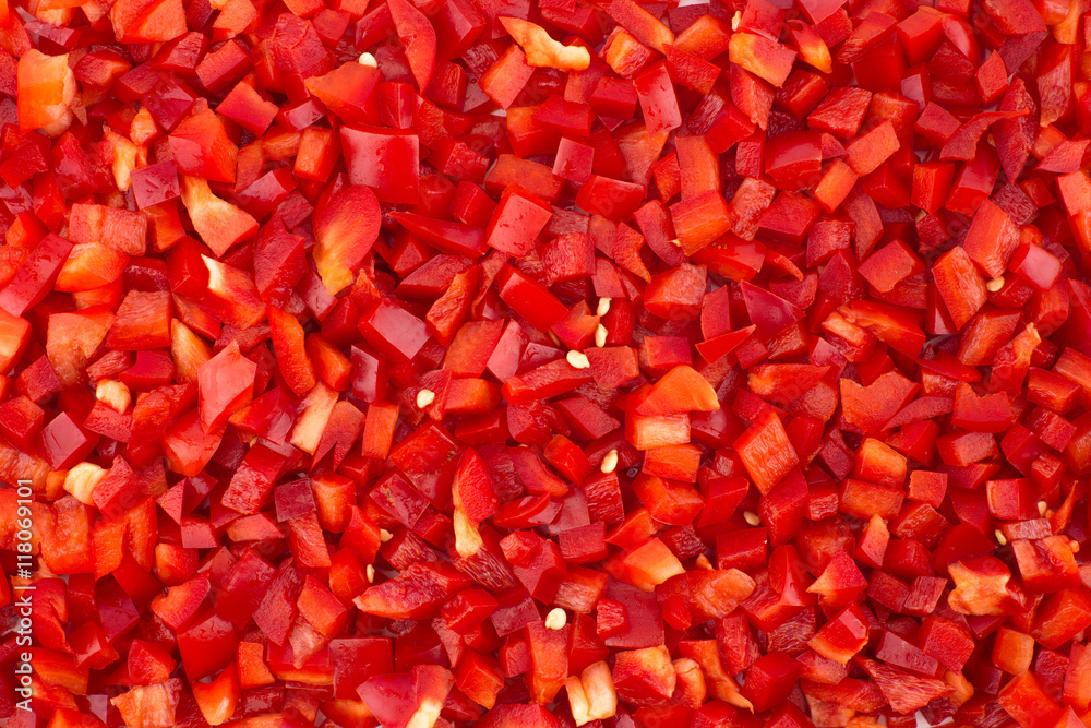 Wall mural chopped red peppers texture background.