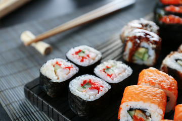 Sushi roll set on wooden board