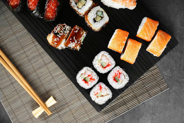 Sushi roll set on wooden board