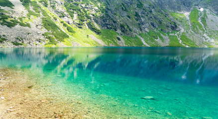 Fototapeta na wymiar beautiful black pond (polish: czarny staw) in High Tatra Mountains, Poland