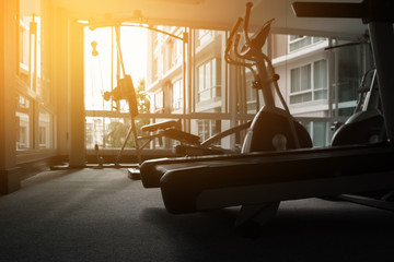 fitness gym with treadmills and any fitness machines. silhouette