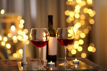 Romantic composition with wine on blurred background