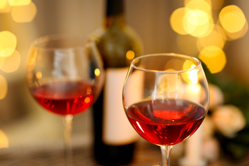 Romantic composition with wine on blurred background
